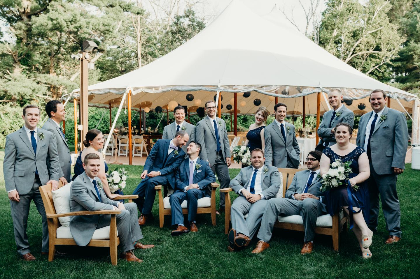 A wedding part outside of a tent