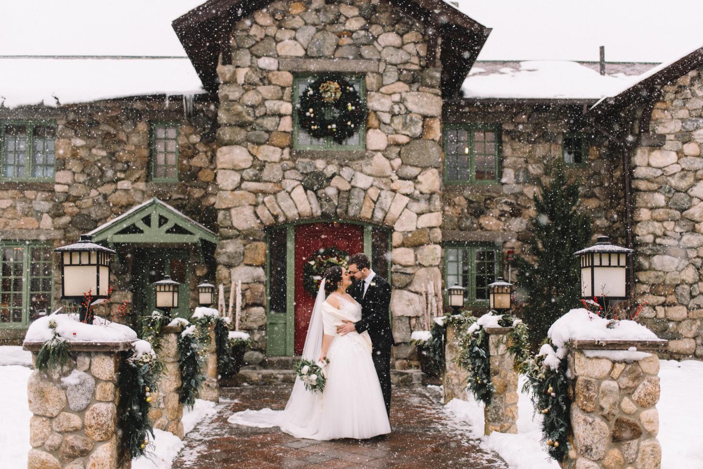 couple in the snow on wedding day